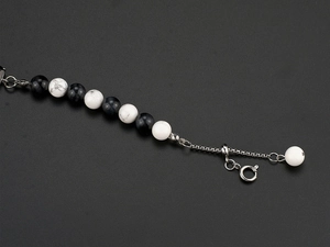 Detail of hip-hop natural stone bead bracelet with adjustable silver steel chain