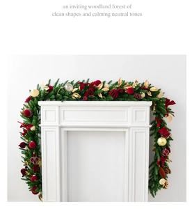 Velvet ball Christmas garland with burgundy ornaments on white modern fireplace