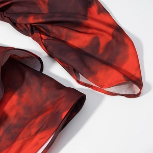 Detail of red and black gradient flame print fabric with high-quality double stitching