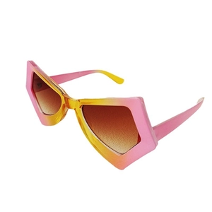 Oversized geometric cat-eye sunglasses with pink yellow gradient frames and brown lenses
