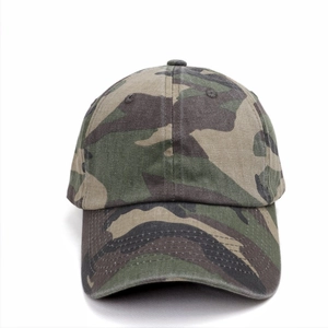 Detail of woodland camouflage baseball cap featuring six-panel construction and curved brim