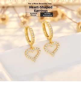 Detailed macro view of gold hollow heart earrings featuring premium AAAAA white cubic zirconia