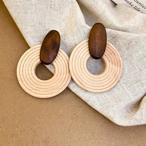 Bohemian large wooden hoop earrings with dark brown oval charms and textured wood rings