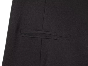 Macro view of a classic black welt pocket on high-quality pleated fabric detail