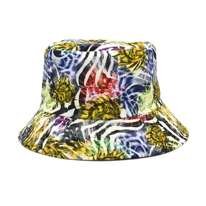 Detailed close-up of vibrant sunflower and zebra print patterns on a cotton bucket hat