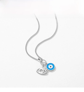 Detailed close-up of S925 sterling silver evil eye pendant with sparkling crystals