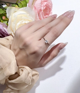 Close-up of S925 sterling silver ring with square Asscher cut moissanite on model hand