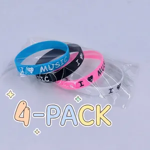 Detailed view of 4-piece set music silicone wristbands in blue black pink and white