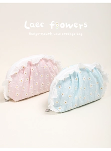Detail of drawstring lace storage bag with daisy floral pattern and delicate lace edges