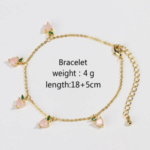 Detail of gold peach bracelet showing lobster clasp, extension chain, and 4g weight