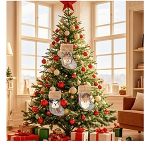 Three hanging Christmas stockings with Santa, Reindeer and Snowman on a festive tree
