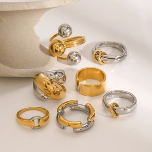 Set of minimalist two-tone stainless steel rings with gold finish and crystal accents
