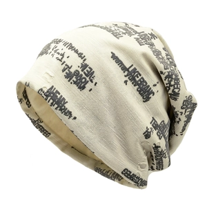 Distressed knit beanie with graffiti letter print and ripped details for street style