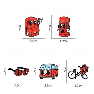Detailed view of red enamel brooch pins set featuring bus, phone booth and bike