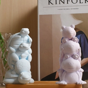 Stacked turtle and frog animal-shaped aromatherapy stone figurines on a wooden tray