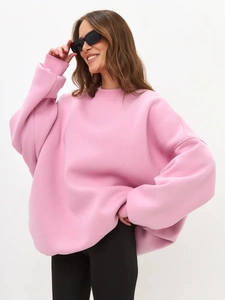 Detail of loose fit crewneck sweatshirt in cherry blossom pink with ribbed cuffs