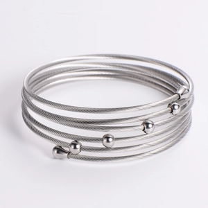 Multilayer stainless steel cable bracelet in silver finish with polished round beads
