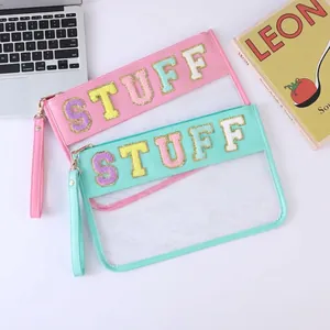 Waterproof clear PVC makeup bag with STUFF towel embroidery and golden zip detail