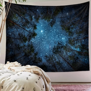 Detailed close-up of a forest starry night tapestry hanging on a minimalist bedroom wall