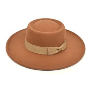 Top view of a caramel wool felt fedora featuring a champagne grosgrain bow ribbon