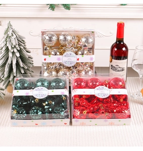 Detailed view of assorted Christmas ball ornaments in gold, red and green gift boxes