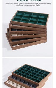 Close-up of walnut wood jewelry tray featuring multiple compartments and velvet lining