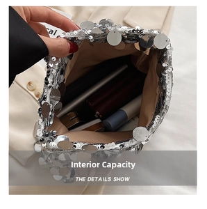 Detailed internal capacity showing silver sequin handbag holding phone and cosmetics
