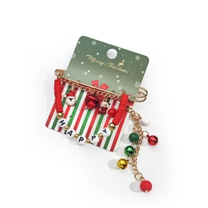 Détail du bracelet de Noël avec Père Noël, cloches et perles Happy sur chaîne dorée