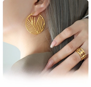 Detail of 18k gold plated surgical titanium steel bamboo leaf earrings and ring set