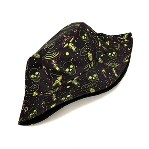 Detailed pattern view of black canvas bucket hat with neon skull and mushroom prints