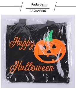 Close-up of Halloween pumpkin candy tote bag in clear plastic packaging