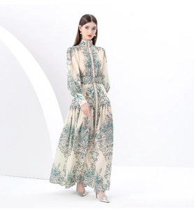 Close-up of bohemian paisley floral maxi dress with stand collar and lantern sleeves