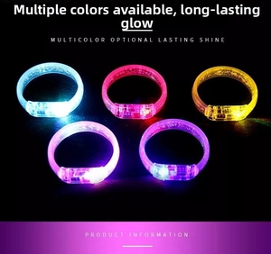 Detail of five glowing LED bracelets in blue, pink, yellow, and purple colors for events