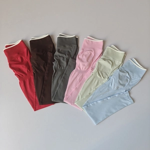 Close-up of high-waist seamless yoga leggings in six vibrant colors with ribbed waistbands