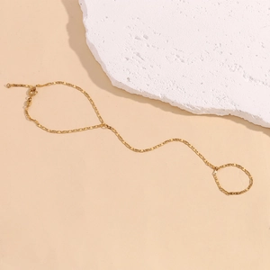 Detailed view of 18K gold plated hand chain featuring minimalist flat S-link design