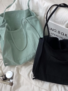 Minimalist canvas tote bag with front pocket in mint green and black styles