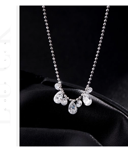 Macro shot of S925 silver necklace featuring seven pear-cut sparkling zircon pendants