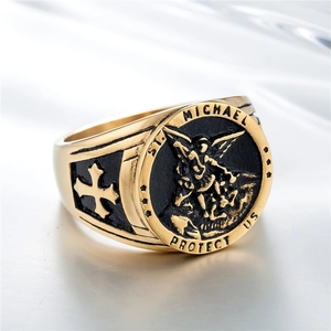 Gold St. Michael angel wings cross ring with engraved shield and religious relief