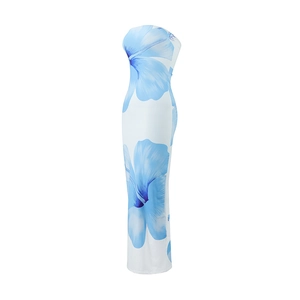 Detail of the elegant blue floral print on a white strapless maxi dress for summer