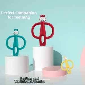 Close-up of 2-in-1 silicone baby teether toothbrush with easy-grip handles and soft bristles