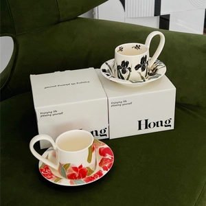 Vintage iris ceramic coffee cup and saucer set with luxury gift box on velvet