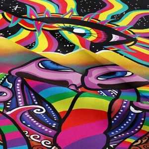 Macro detail of psychedelic eye pattern on colorful tapestry with vibrant fabric texture