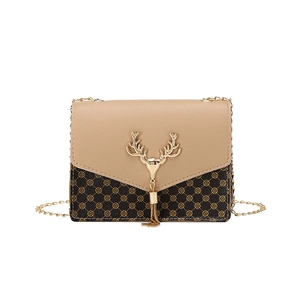 Detail of crossbody bag featuring khaki flap, monogram pattern and golden deer head ornament