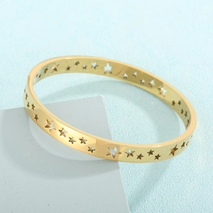 Detailed view of 18K gold plated bangle featuring precision hollow star pattern engravings