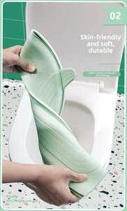 Close-up of flexible light green waterproof EVA toilet seat cover with non-slip texture