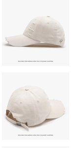 Detail of distressed beige baseball cap with star embroidery and adjustable metal buckle