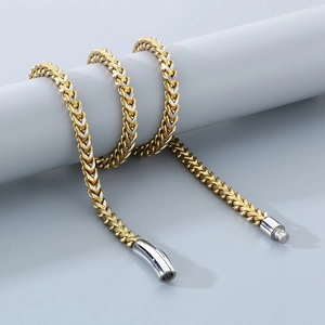 Gold and silver two-tone dragon bone chain necklace with matte finish and secure clasp