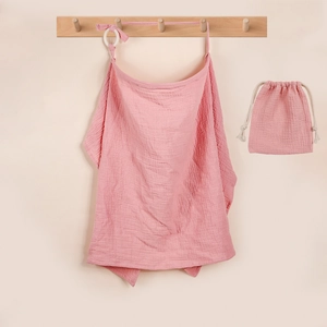 Pink muslin cotton nursing cover with white adjustment ring and matching drawstring bag