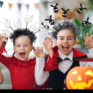 Kids Halloween headbands featuring white skeleton hands and black bat skull party designs