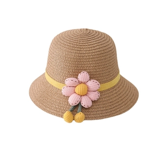 Kids woven straw sun hat with yellow ribbon and pink floral decoration for summer